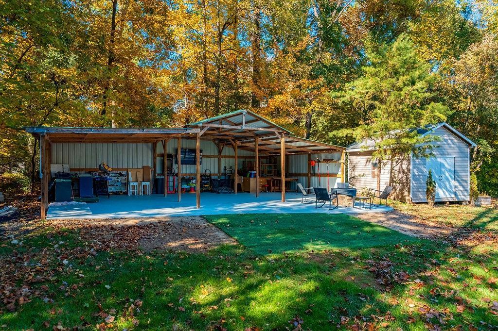 2741 Creek Point Road Graham, NC 27253 - Photo 31 of 36 a front view of a house with a garden