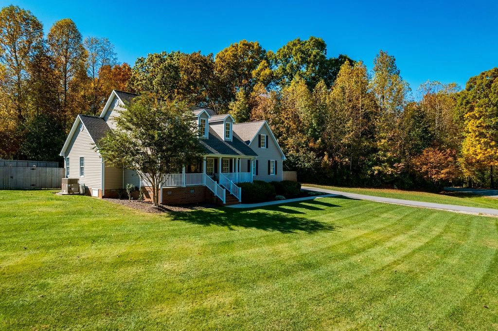 2741 Creek Point Road Graham, NC 27253 - Photo 34 of 36 a view of a house with backyard and sitting area