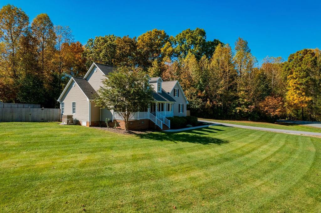 2741 Creek Point Road Graham, NC 27253 - Photo 36 of 36 a view of a house with a yard and sitting area