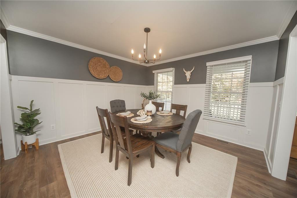 2741 Creek Point Road Graham, NC 27253 - Photo 5 of 36 a view of a dining room with furniture window and wooden floor