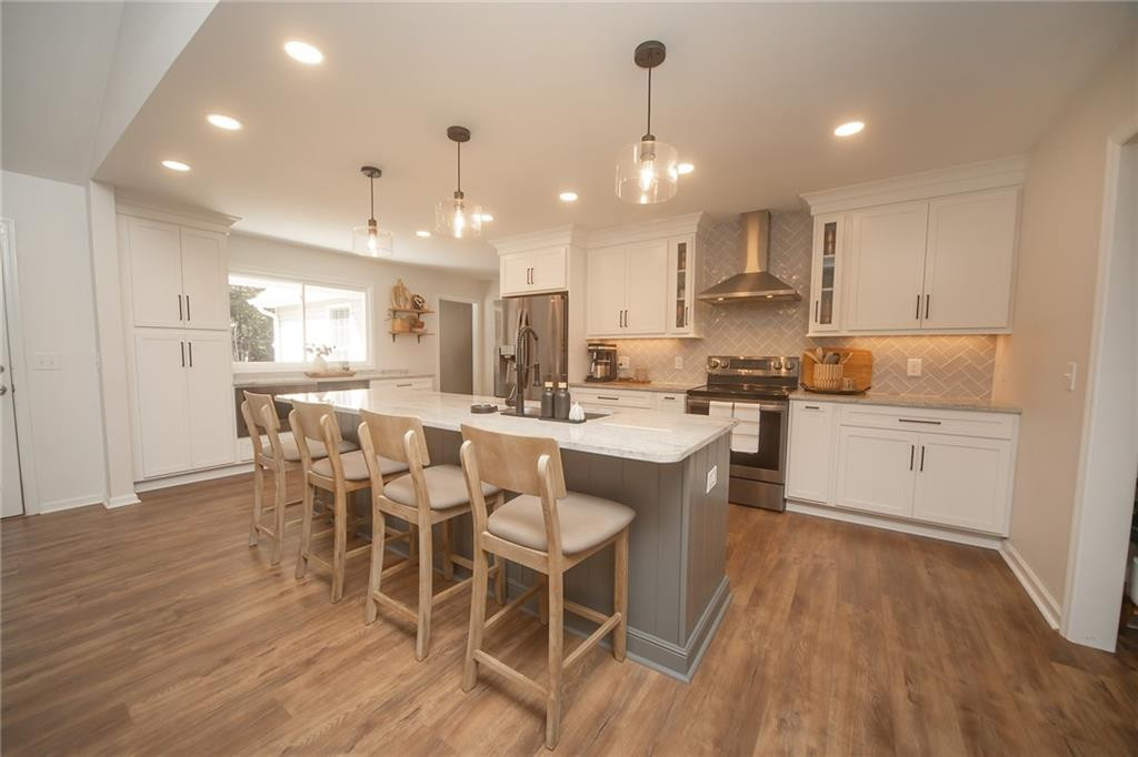 2741 Creek Point Road Graham, NC 27253 - Photo 10 of 36 a large kitchen with a table and chairs