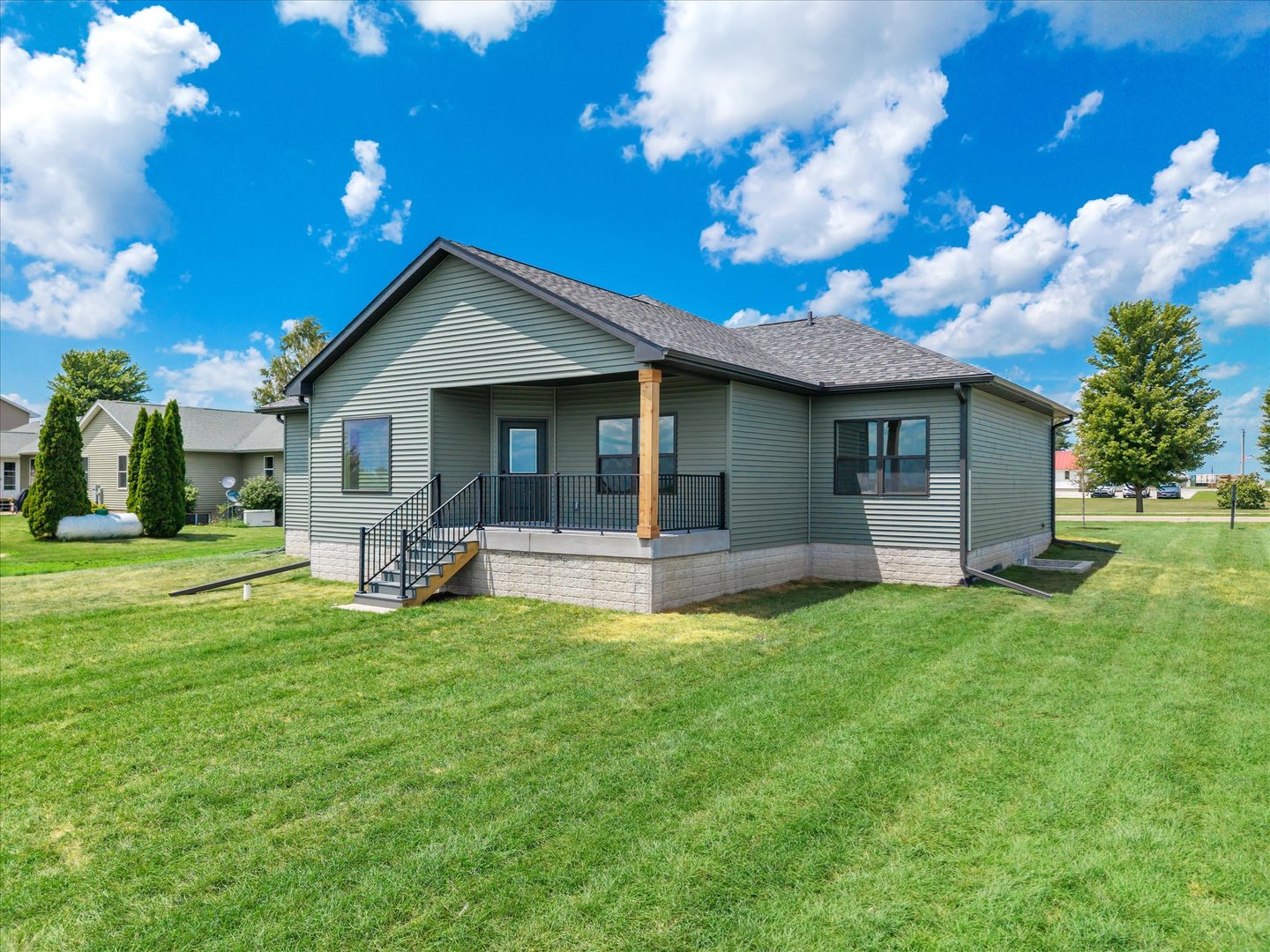 455 Rhonda Road New Liberty, IA 52765 - Photo 2 of 54 a view of a house with a yard and sitting area