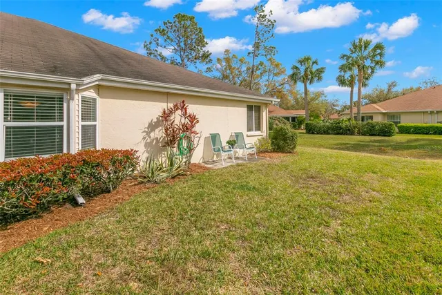 a front view of house with yard and seating space