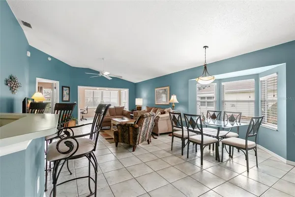 a view of a dining room with furniture window and outside view