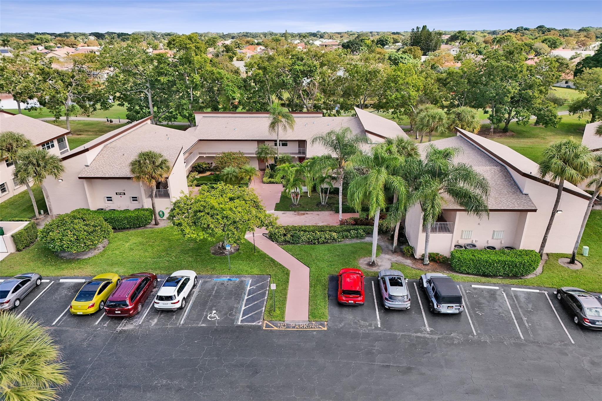 8740 Azalea Court, Unit 102 Tamarac, FL 33321 - Photo 17 of 60 an aerial view of a house with garden space and street view