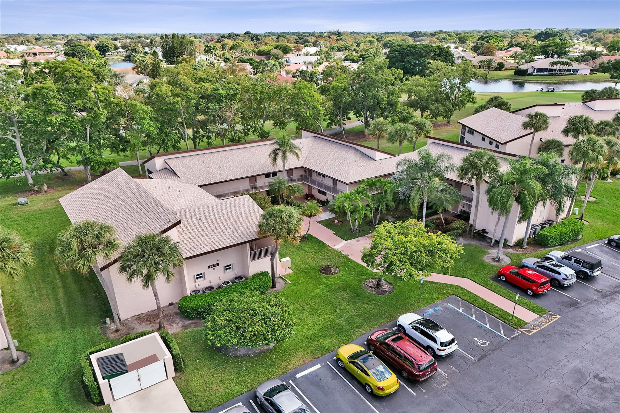 8740 Azalea Court, Unit 102 Tamarac, FL 33321 - Photo 18 of 60 an aerial view of a house with yard swimming pool and outdoor seating