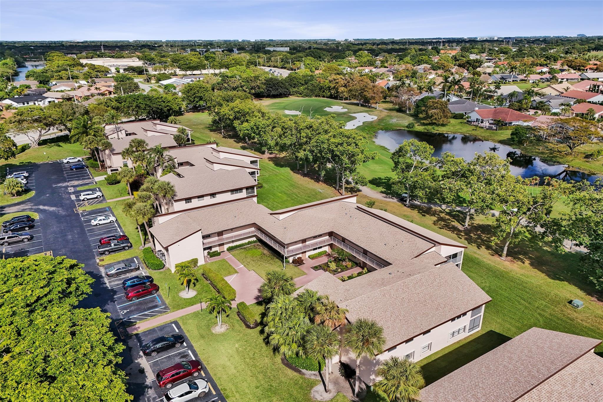8740 Azalea Court, Unit 102 Tamarac, FL 33321 - Photo 27 of 60 an aerial view of a house with a lake