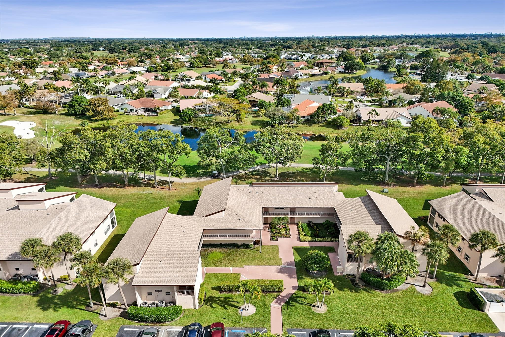 8740 Azalea Court, Unit 102 Tamarac, FL 33321 - Photo 28 of 60 an aerial view of a house with a yard