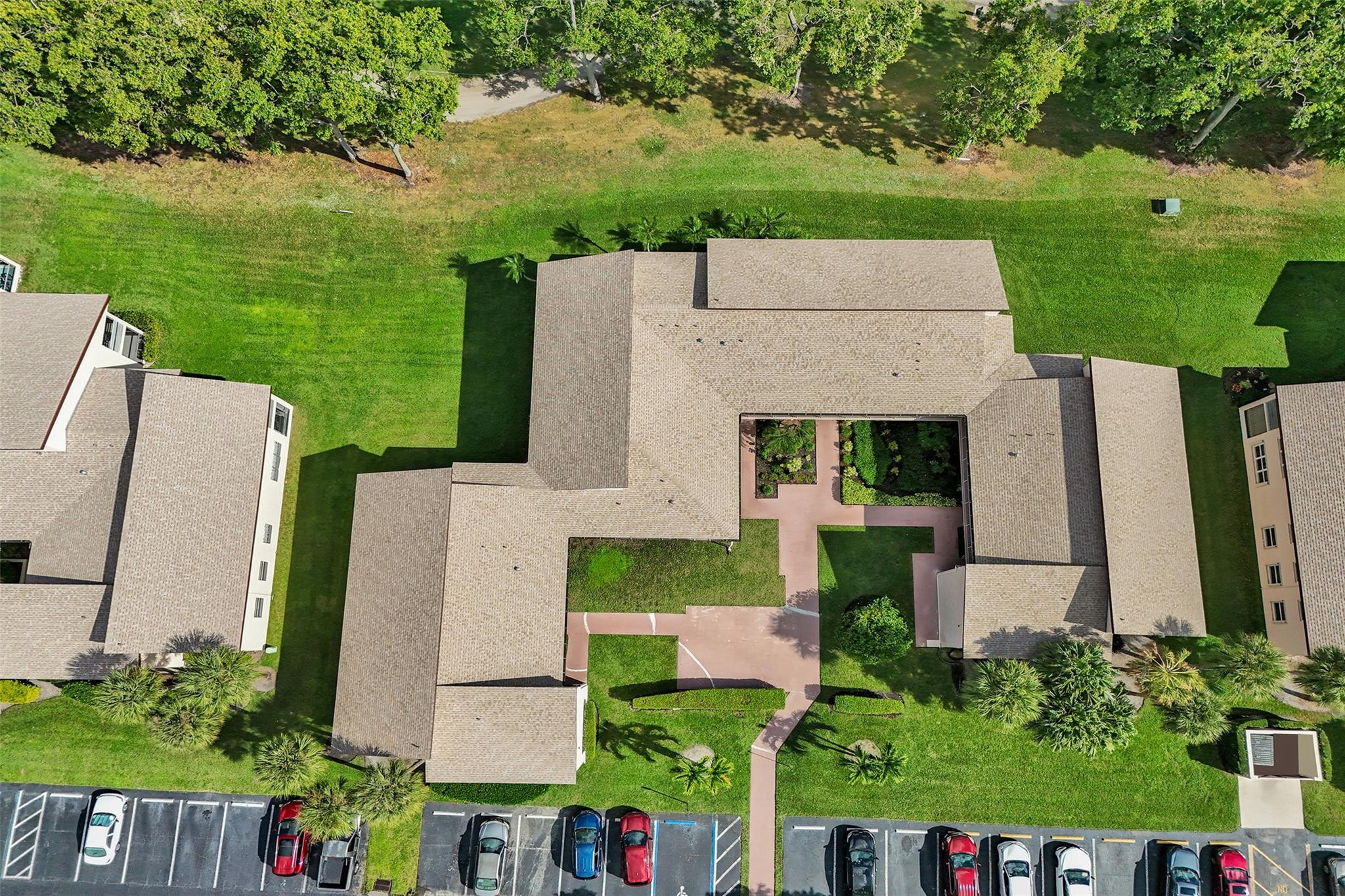8740 Azalea Court, Unit 102 Tamarac, FL 33321 - Photo 29 of 60 an aerial view of a house with a garden