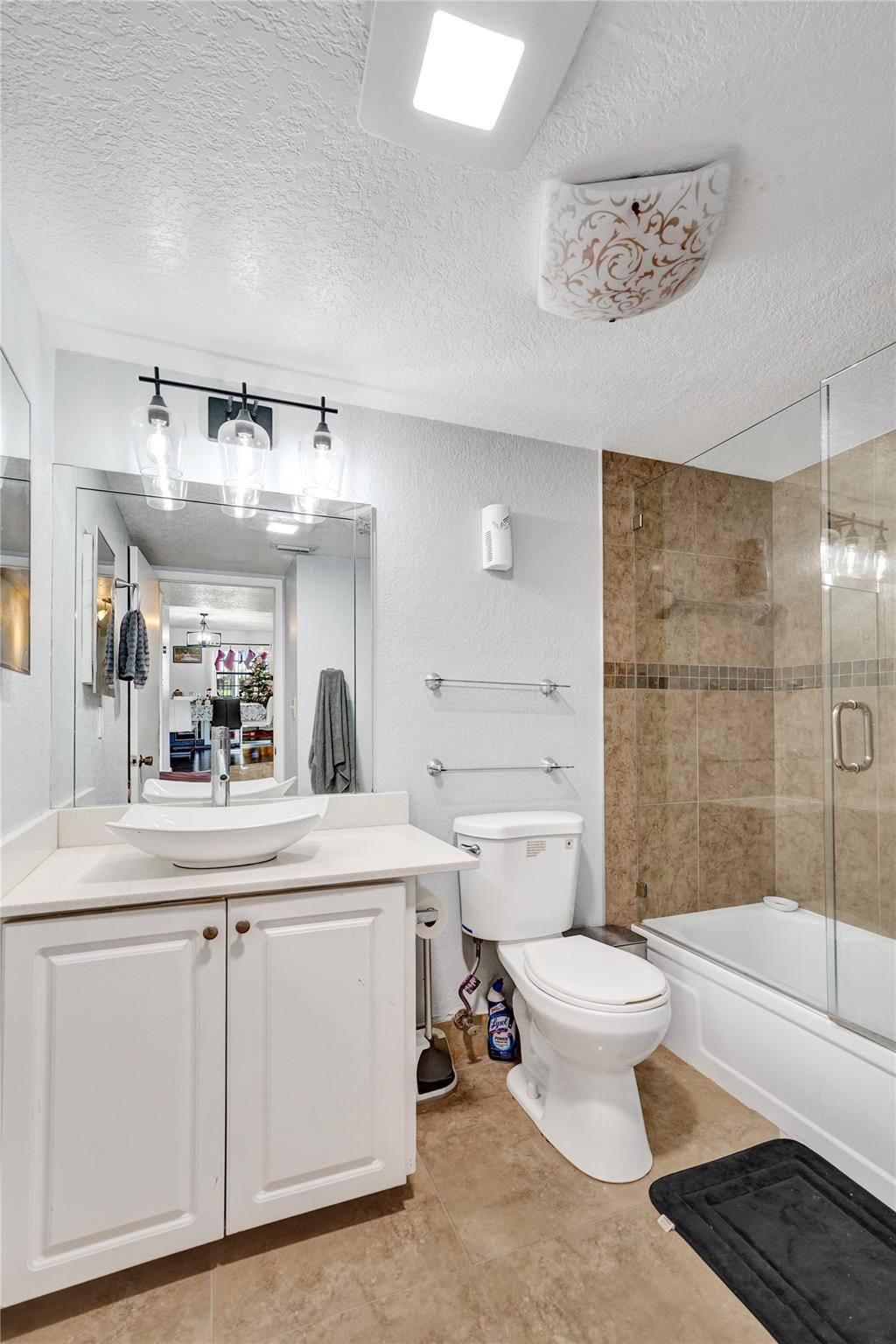8740 Azalea Court, Unit 102 Tamarac, FL 33321 - Photo 49 of 60 a bathroom with a sink a toilet and a bathtub
