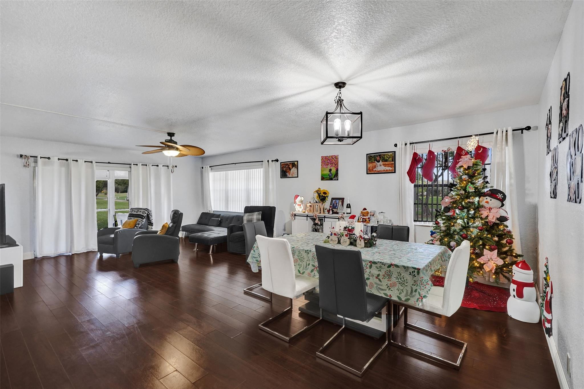 8740 Azalea Court, Unit 102 Tamarac, FL 33321 - Photo 50 of 60 a living room with furniture and a chandelier
