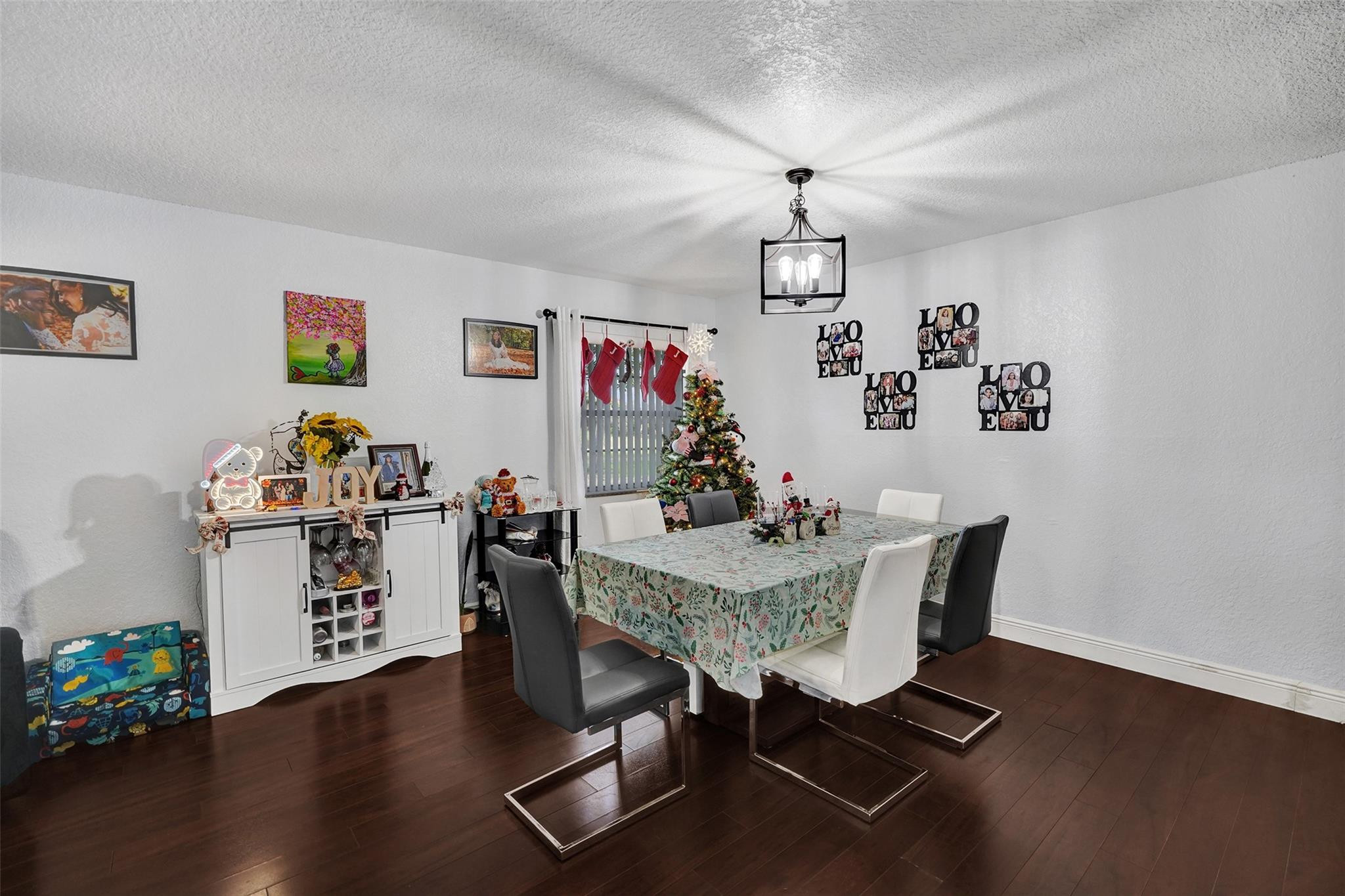 8740 Azalea Court, Unit 102 Tamarac, FL 33321 - Photo 51 of 60 a view of a dining room with furniture and wooden floor