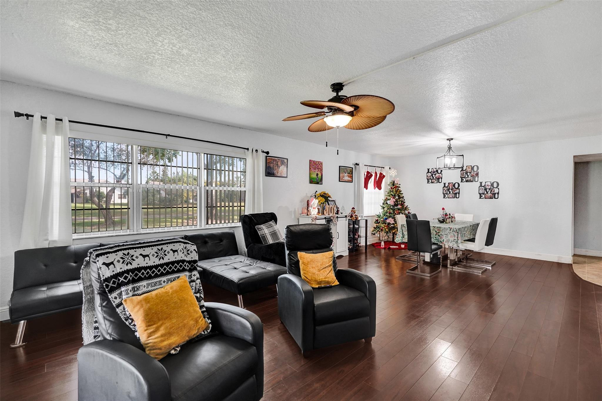 8740 Azalea Court, Unit 102 Tamarac, FL 33321 - Photo 52 of 60 a living room with furniture and wooden floor
