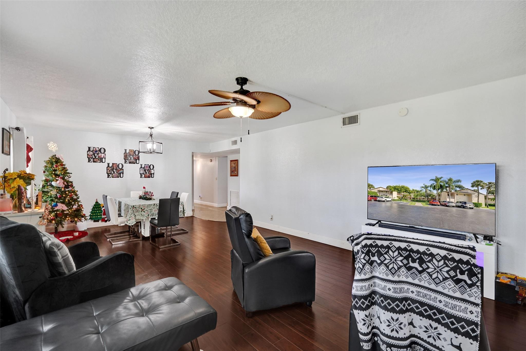 8740 Azalea Court, Unit 102 Tamarac, FL 33321 - Photo 53 of 60 a living room with furniture and a rug