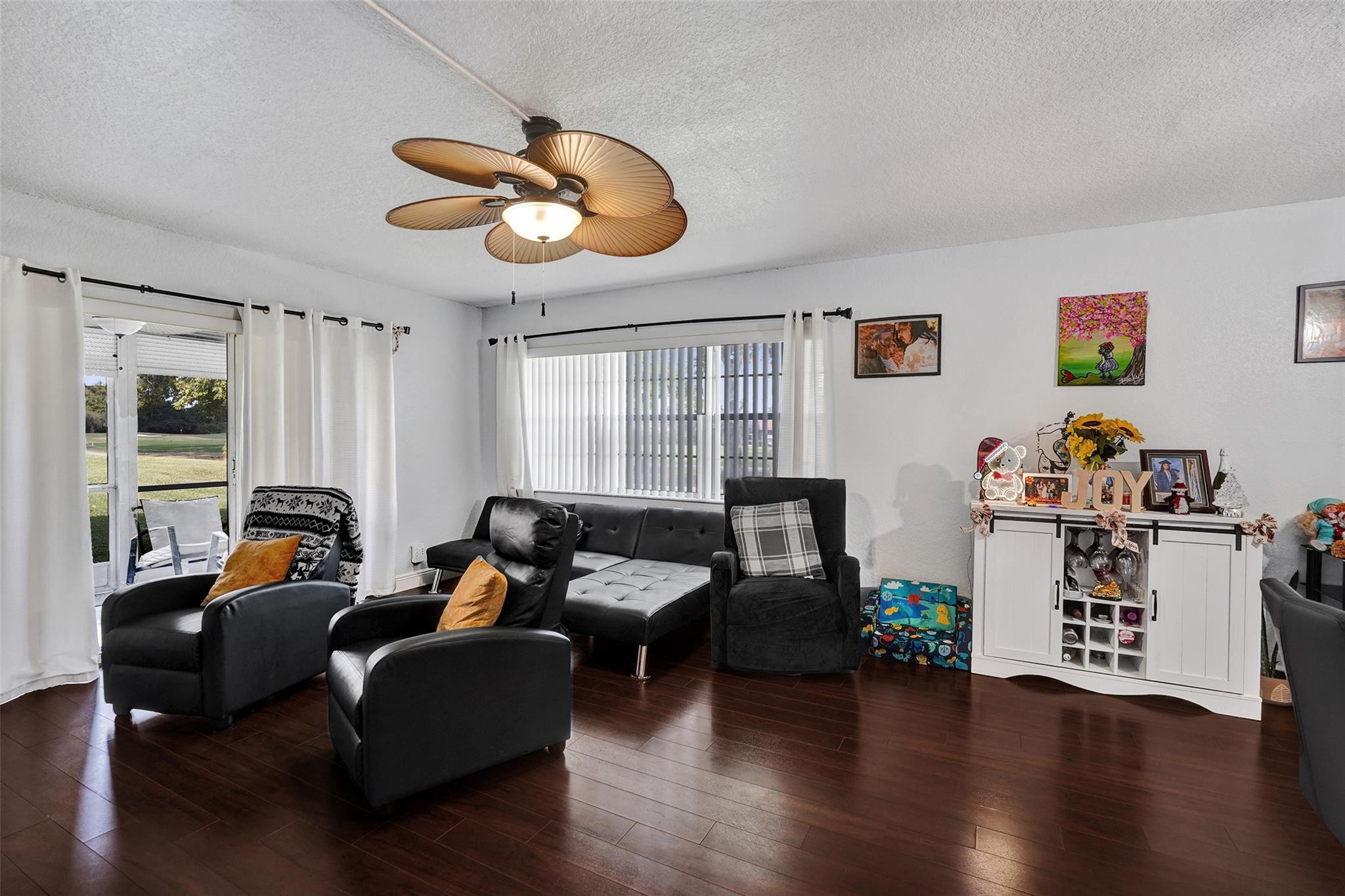 8740 Azalea Court, Unit 102 Tamarac, FL 33321 - Photo 54 of 60 a living room with furniture and a window