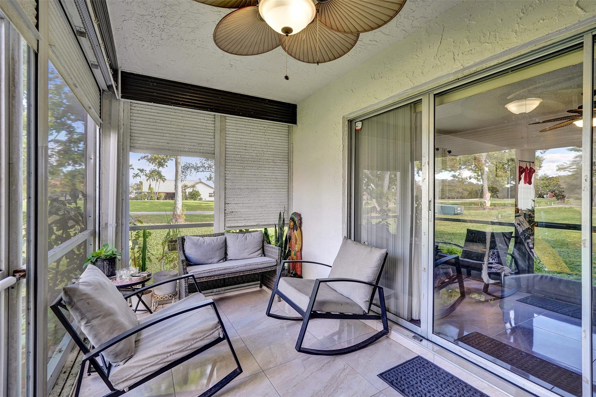 8740 Azalea Court, Unit 102 Tamarac, FL 33321 - Photo 55 of 60 a living room with furniture and a large window