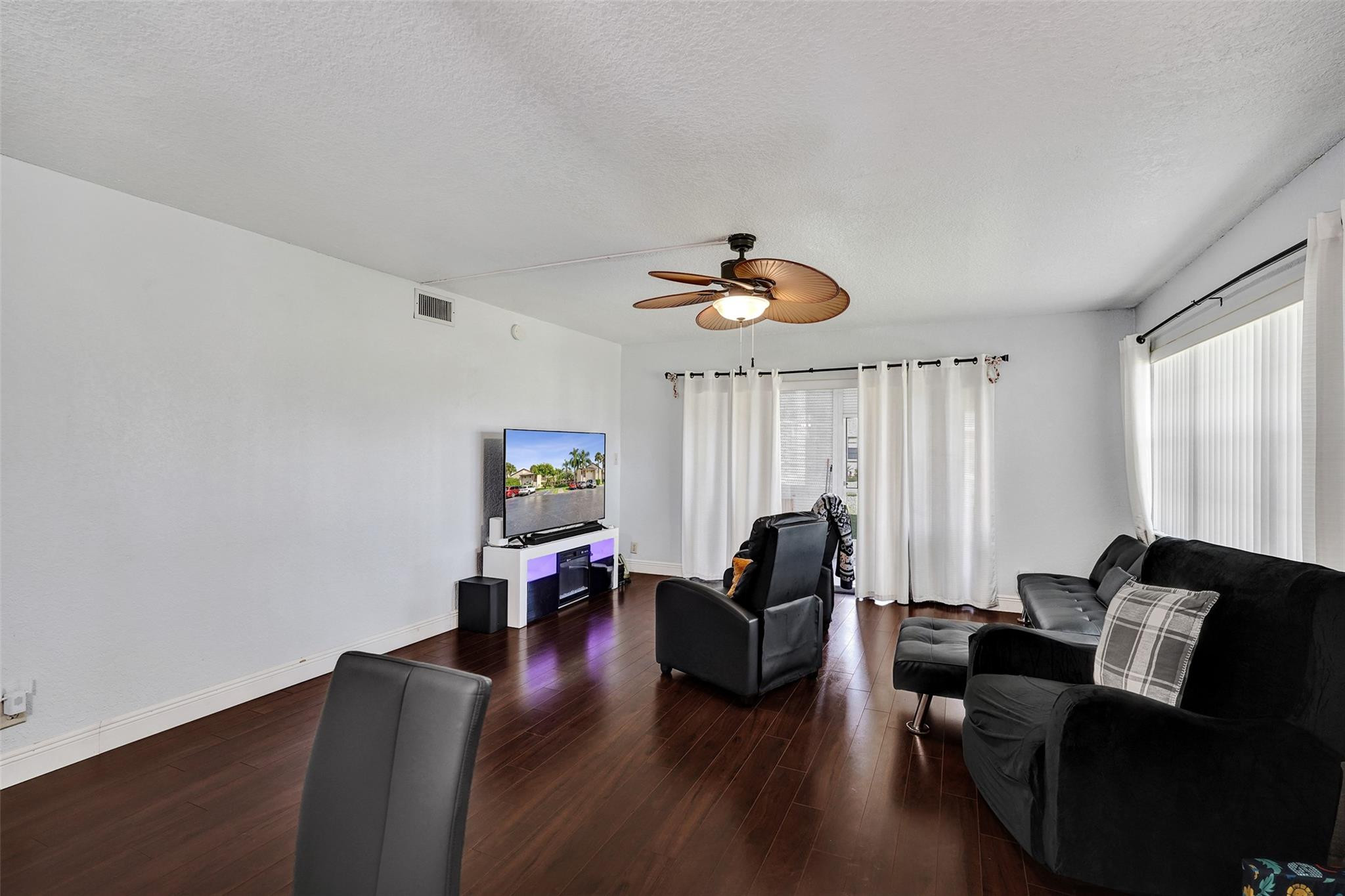 8740 Azalea Court, Unit 102 Tamarac, FL 33321 - Photo 9 of 60 a living room with furniture