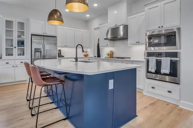 a dining room with furniture and a chandelier