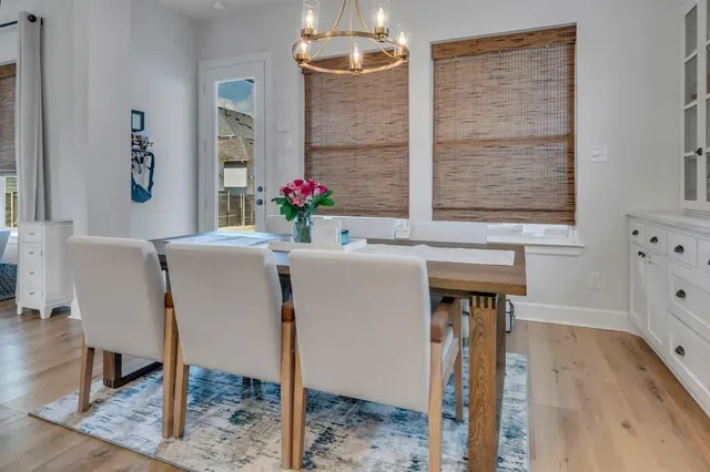 a kitchen with stainless steel appliances a sink a stove and a refrigerator