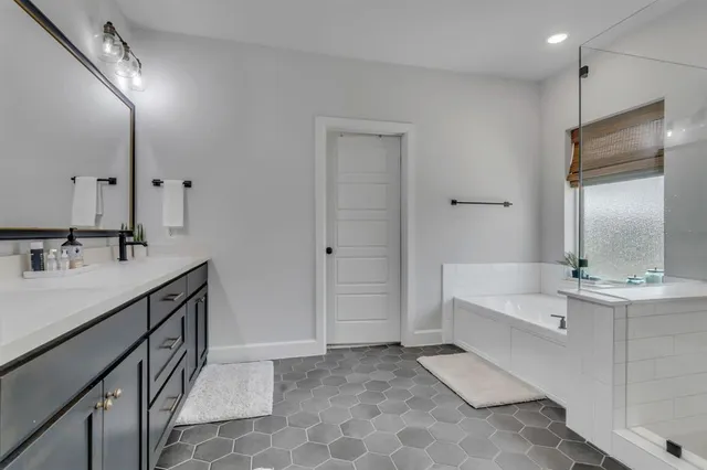 a bedroom with a bed and wall painting