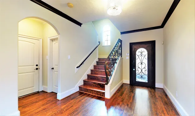 a view of an entryway with wooden floor