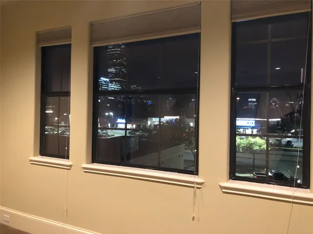 a view of a glass door with glass windows