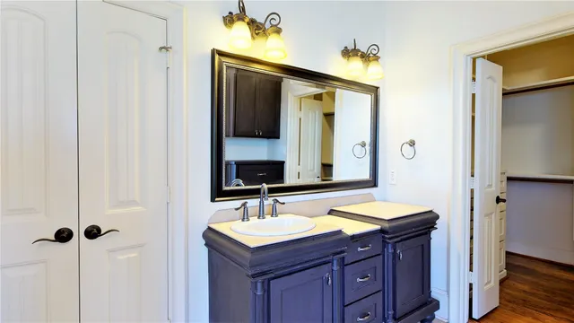 a bathroom with a sink and a mirror