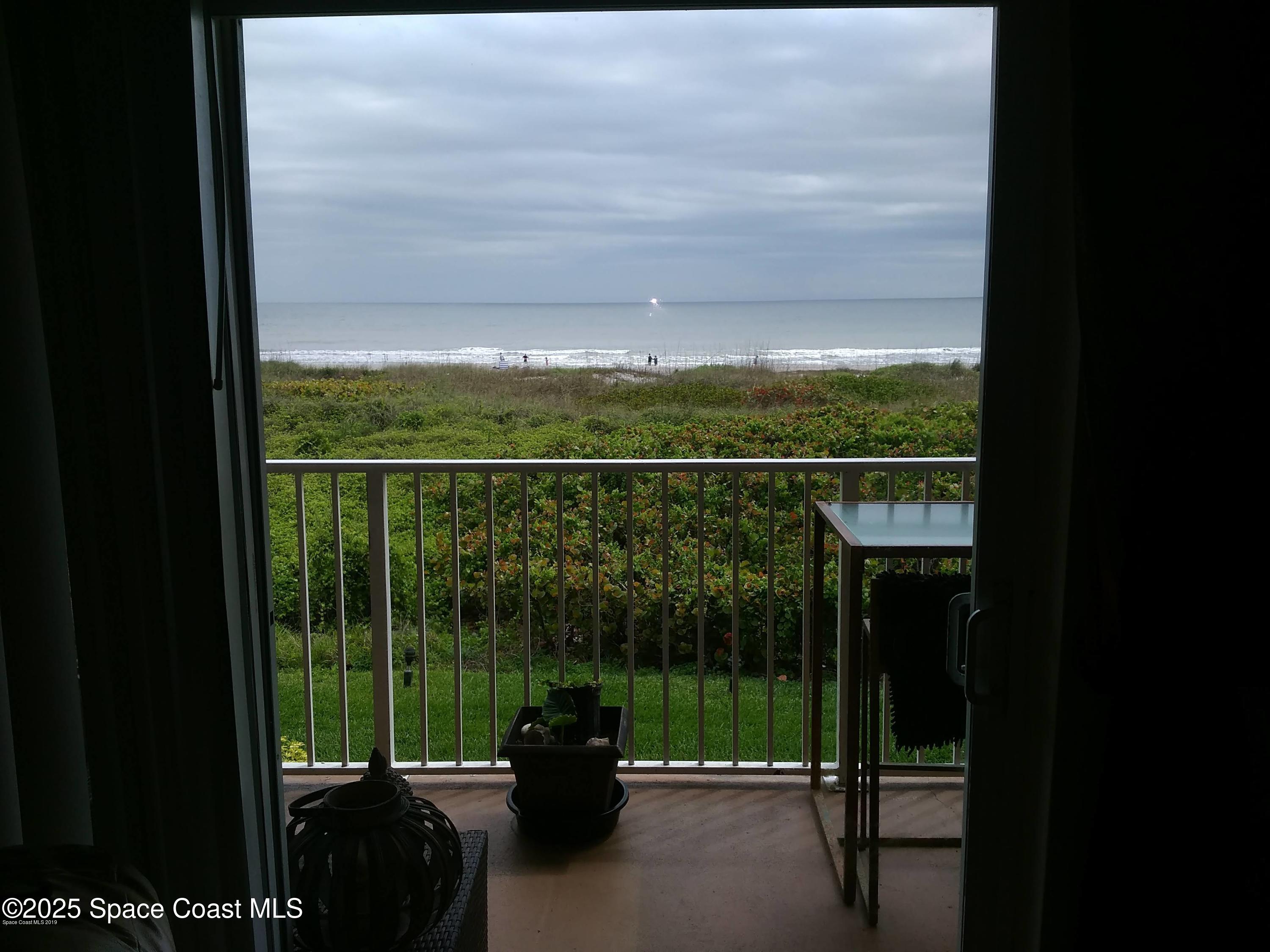 3150 North Atlantic Avenue, Unit 7550 Cocoa Beach, FL 32931 - Photo 4 of 4 a view of a balcony with lake view