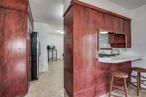 a bathroom with a sink a mirror and shower