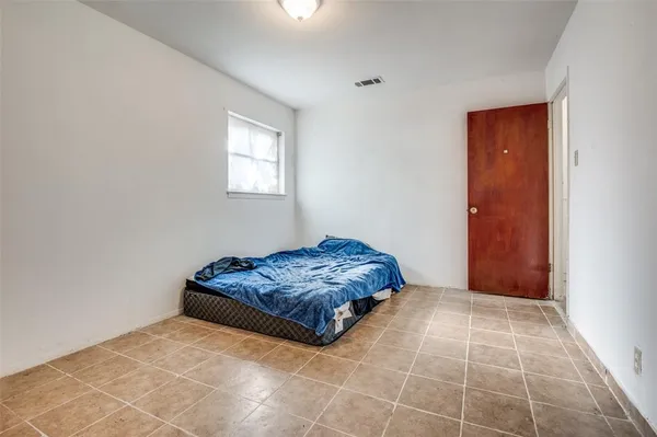 a room with a bed and a window