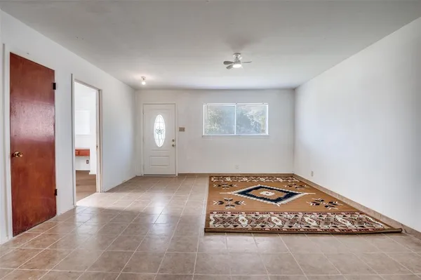 a view of an empty room and window