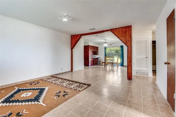 wooden floor in a hall with a window
