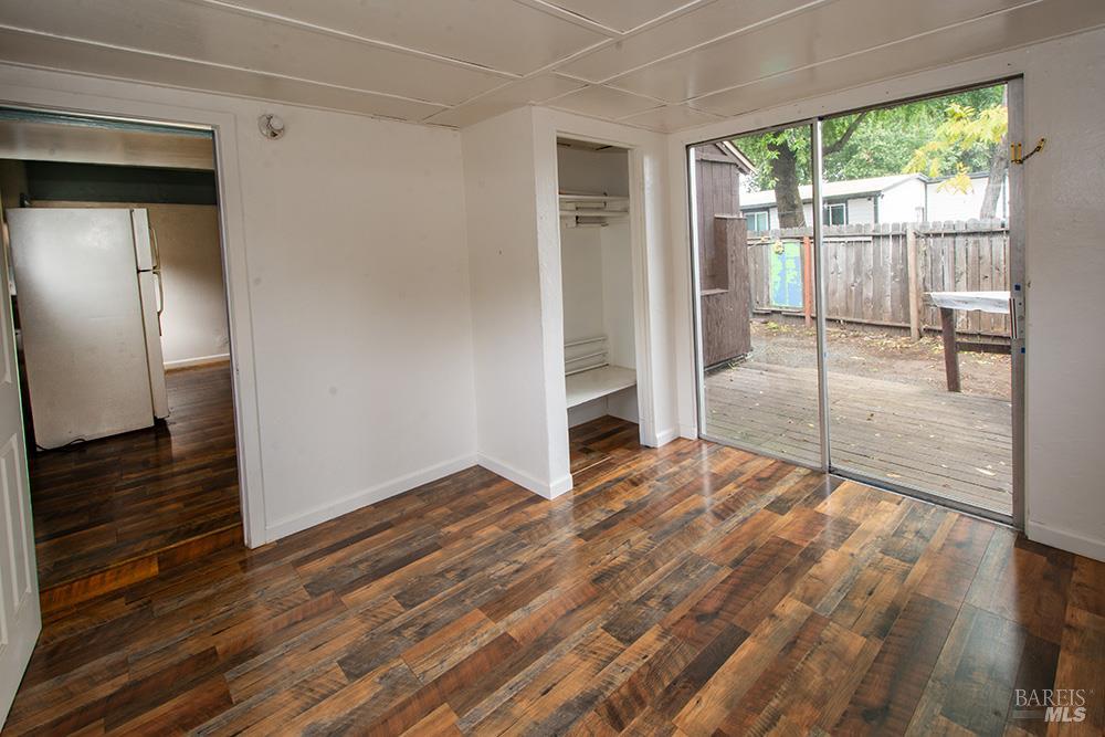 18089 Riverside Drive Sonoma, CA 95476 - Photo 7 of 14 a view of empty room with wooden floor and fan