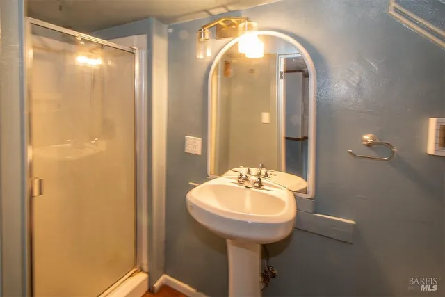 a bathroom with a sink and a mirror