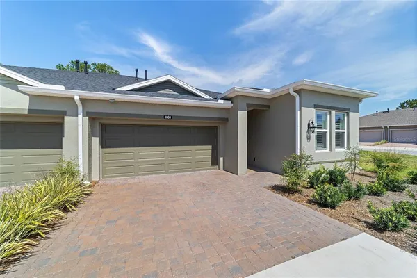 a living room with furniture fireplace and a window
