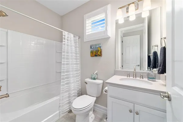 a view of a lake with a house in the background