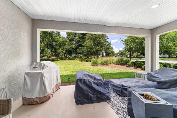 a view of a swimming pool with an outdoor space and seating area
