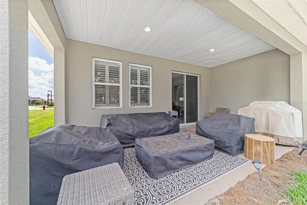 a view of a swimming pool with a yard