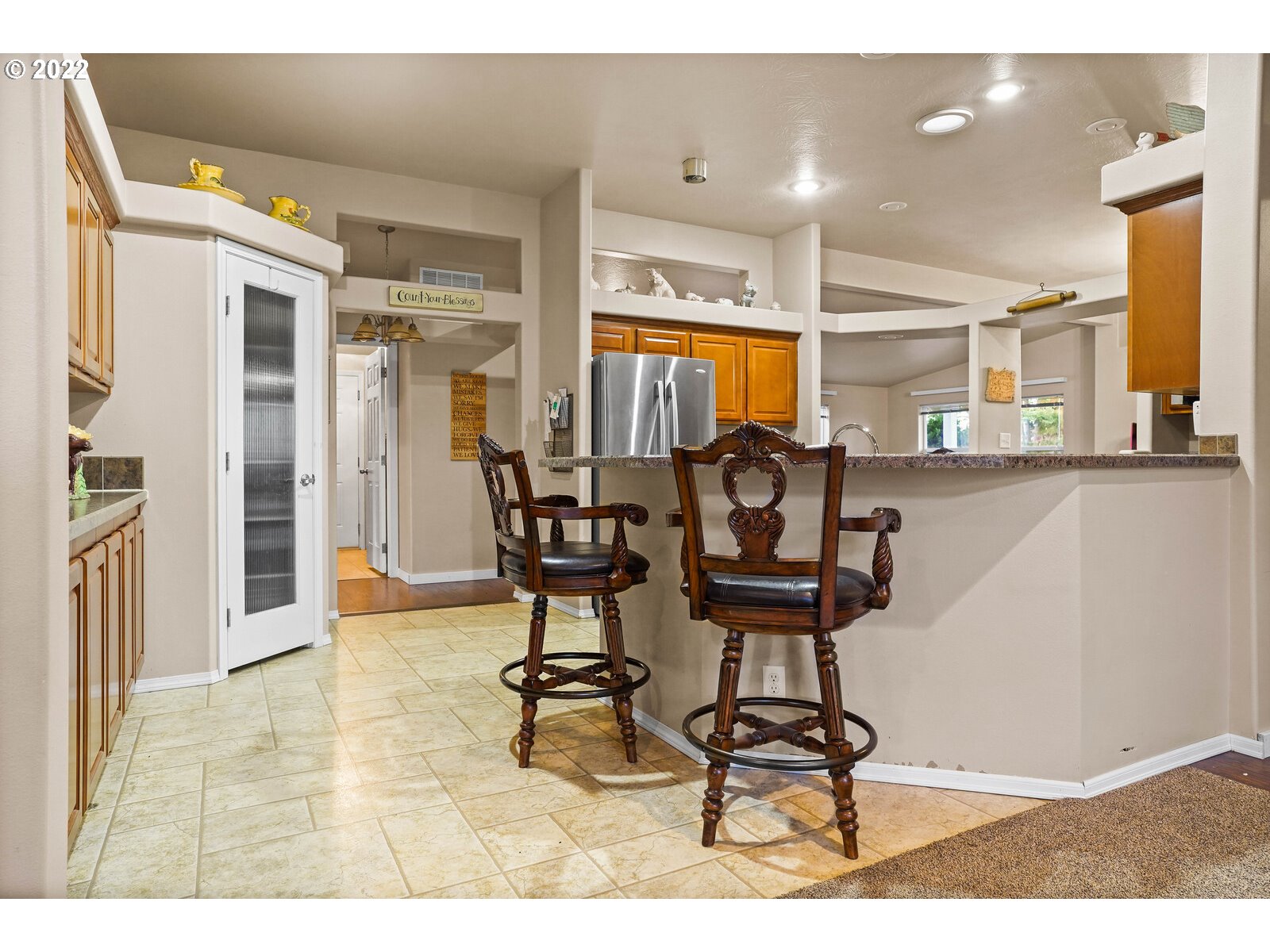 11005 Portland Road Northeast Salem, OR 97305 - Photo 11 of 32 a view of a dining room with furniture and a chandelier
