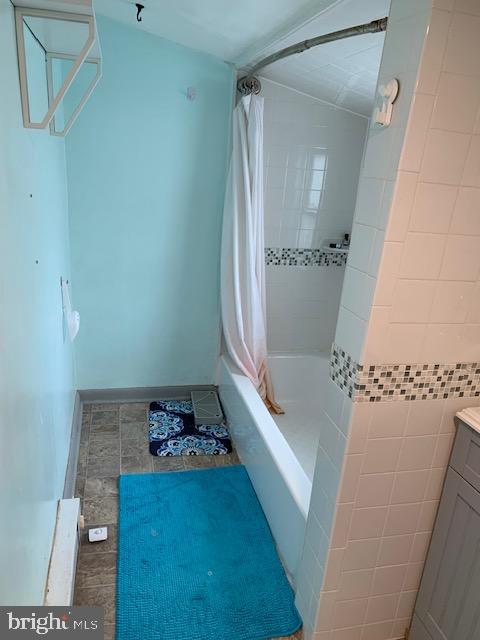 615 South Rose Street Baltimore, MD 21224 - Photo 9 of 11 a bathroom with a bathtub and a shower