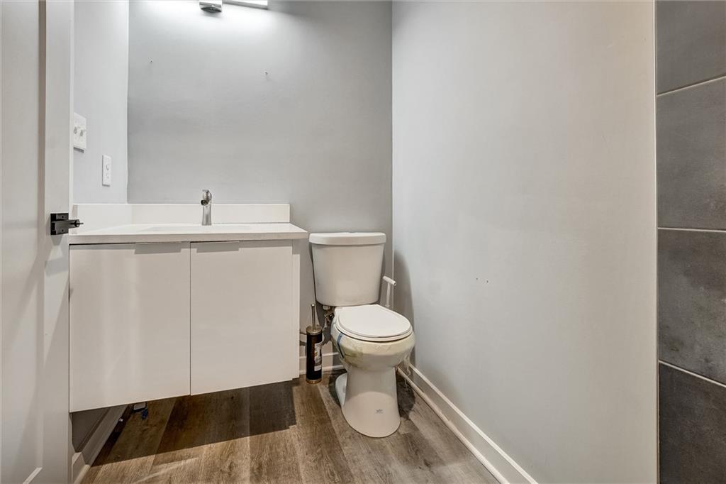 569 Middle Street Southwest Atlanta, GA 30310 - Photo 17 of 35 a white toilet sitting next to a white sink