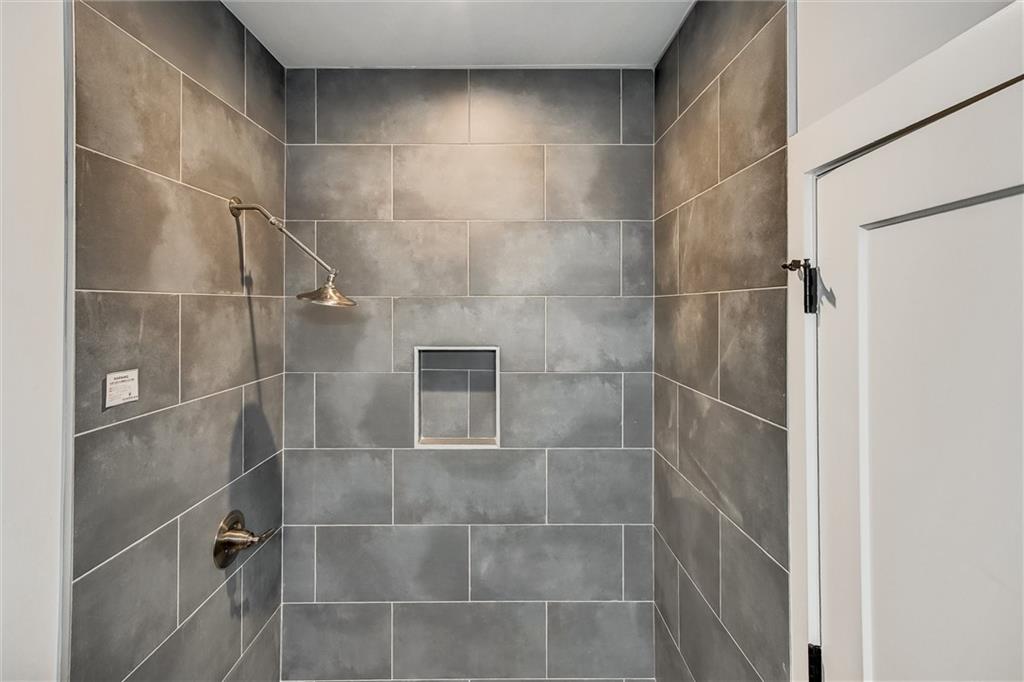 569 Middle Street Southwest Atlanta, GA 30310 - Photo 18 of 35 a bathroom with a glass shower door