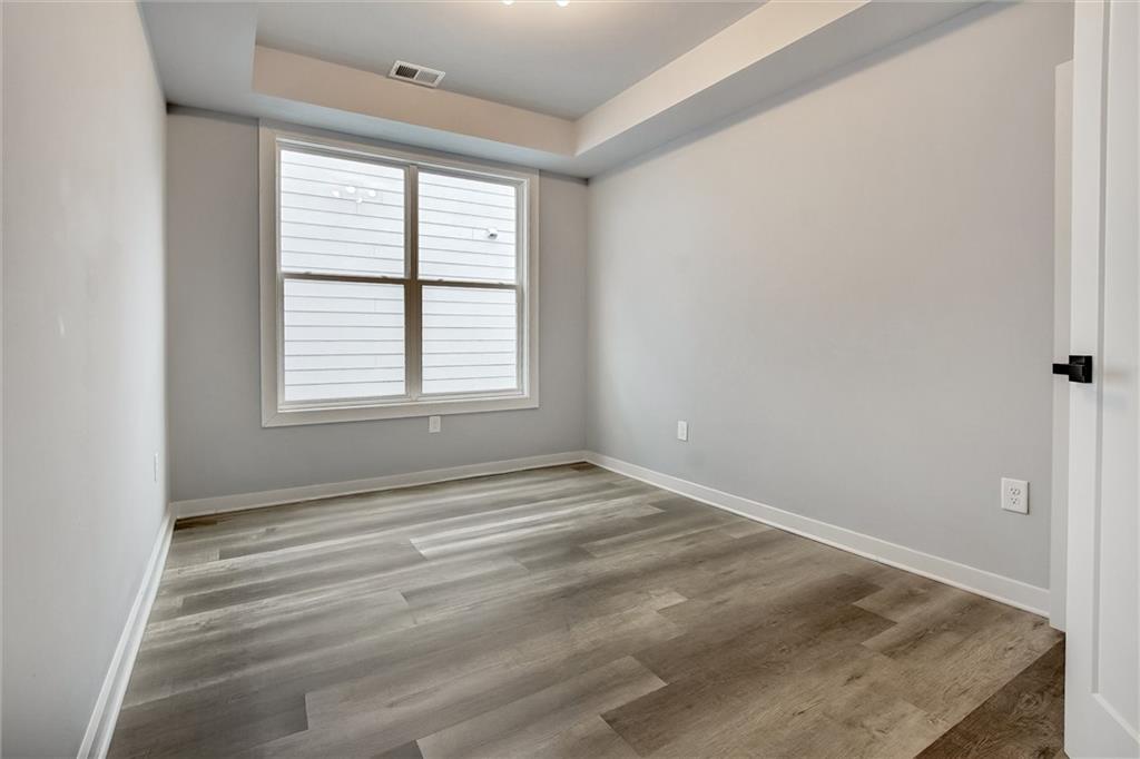 569 Middle Street Southwest Atlanta, GA 30310 - Photo 19 of 35 an empty room with windows