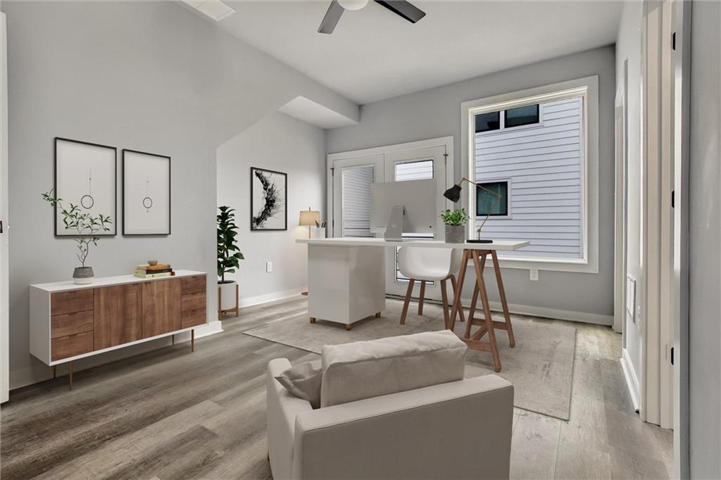 569 Middle Street Southwest Atlanta, GA 30310 - Photo 21 of 35 a living room with furniture and a wooden floor