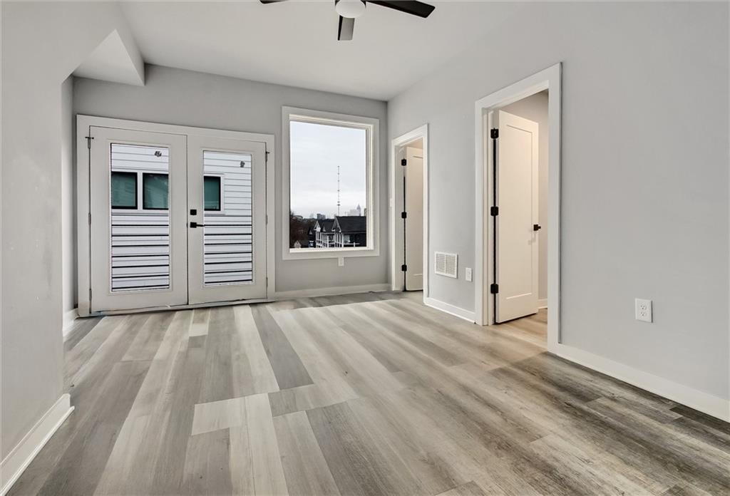 569 Middle Street Southwest Atlanta, GA 30310 - Photo 22 of 35 a view of wooden floor and windows in a room