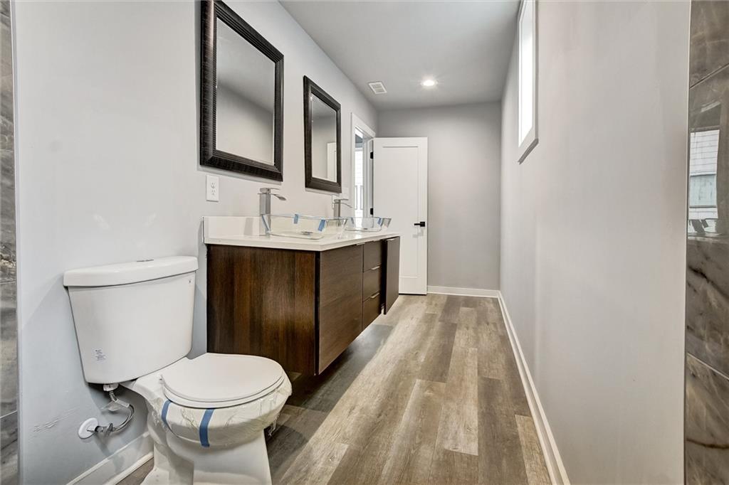 569 Middle Street Southwest Atlanta, GA 30310 - Photo 27 of 35 a bathroom with a sink toilet and mirror