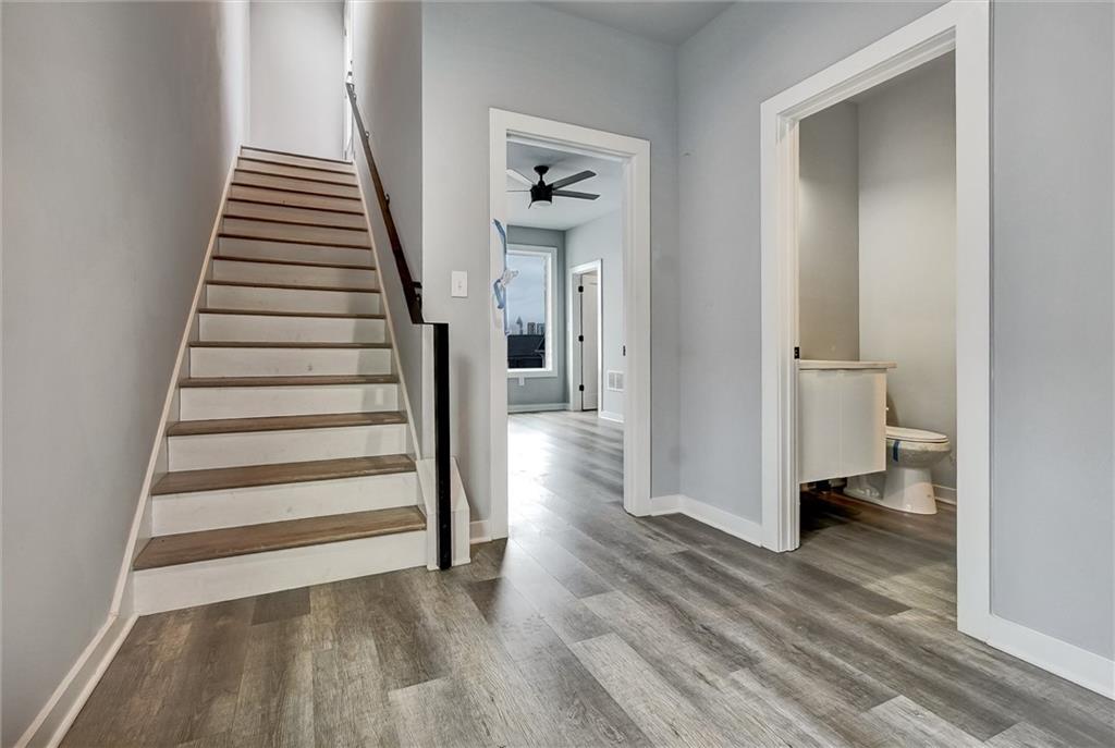 569 Middle Street Southwest Atlanta, GA 30310 - Photo 29 of 35 a view of a hallway with wooden floor and staircase