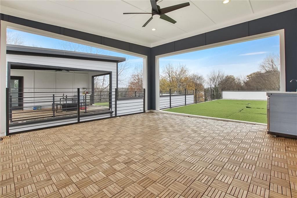 569 Middle Street Southwest Atlanta, GA 30310 - Photo 32 of 35 a view of empty room with wooden floor and fan