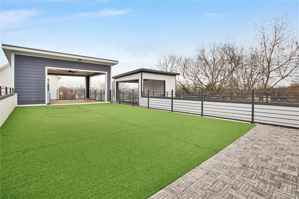 569 Middle Street Southwest Atlanta, GA 30310 - Photo 35 of 35 a view of a house with a big yard and large tree