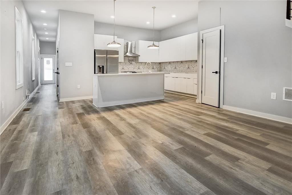 569 Middle Street Southwest Atlanta, GA 30310 - Photo 4 of 35 a view of kitchen with wooden floor